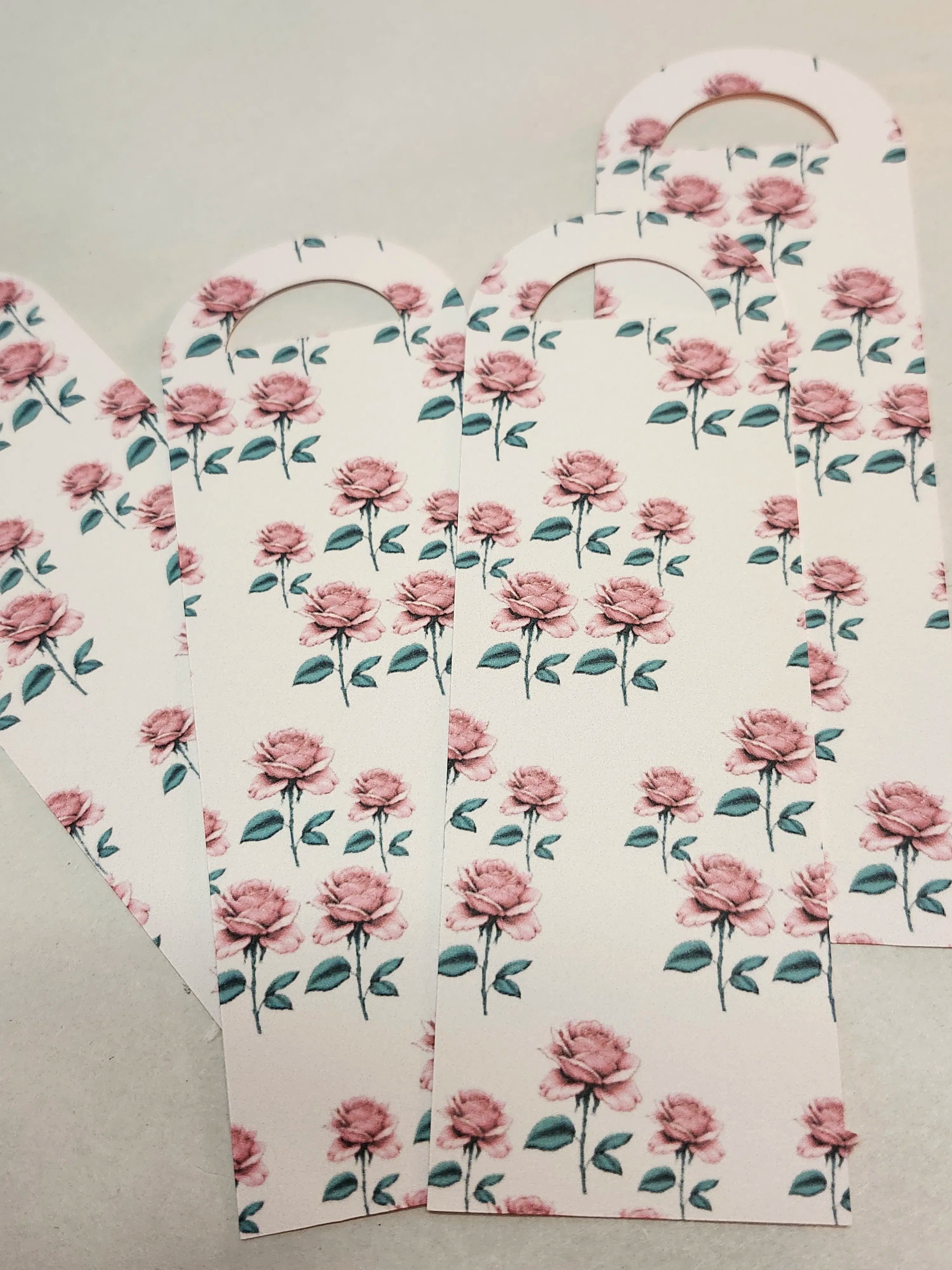 Floral-patterned bookmarks on a light gray background