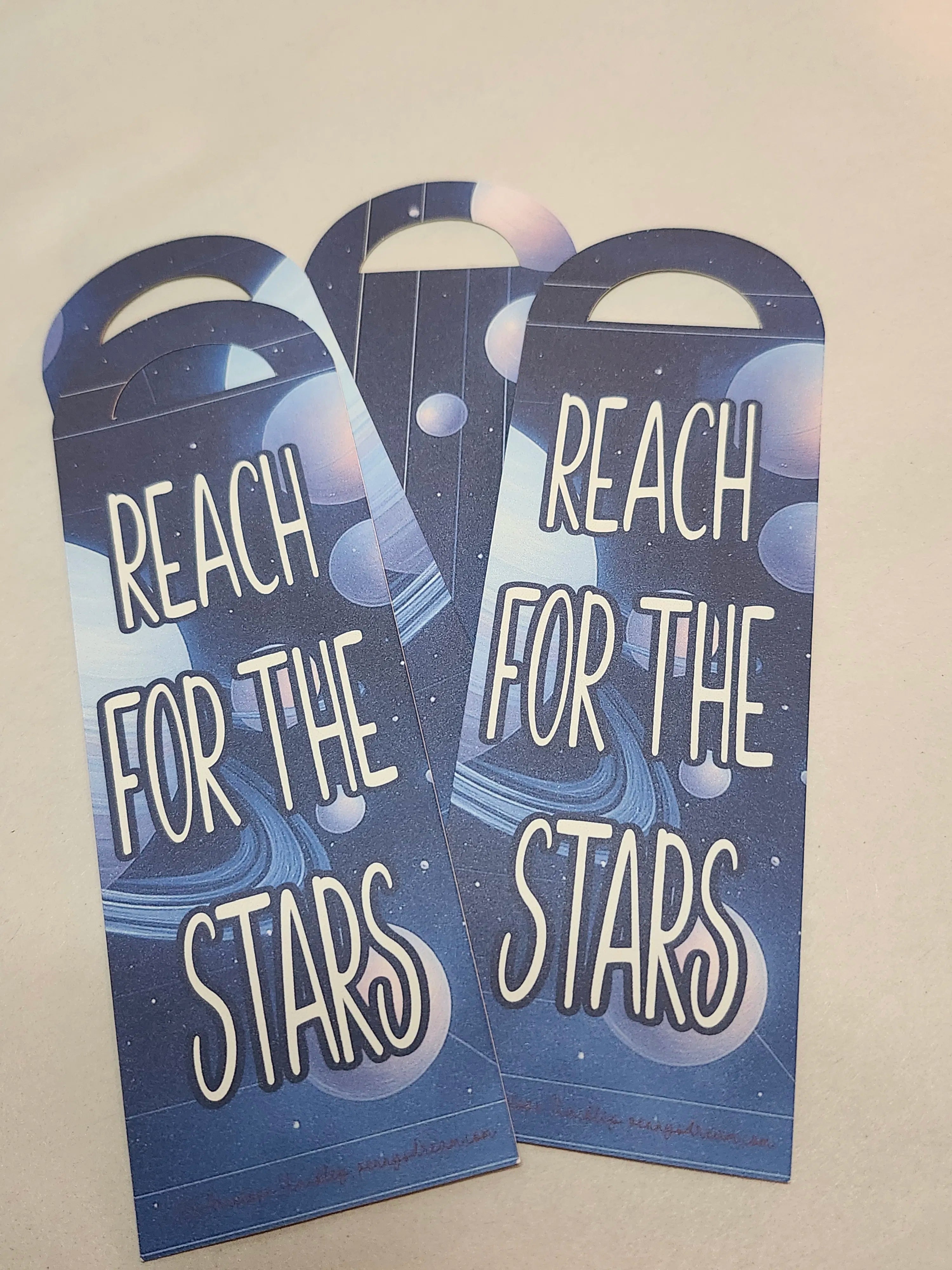 Three 'Reach for the Stars' motivational cards on a beige background