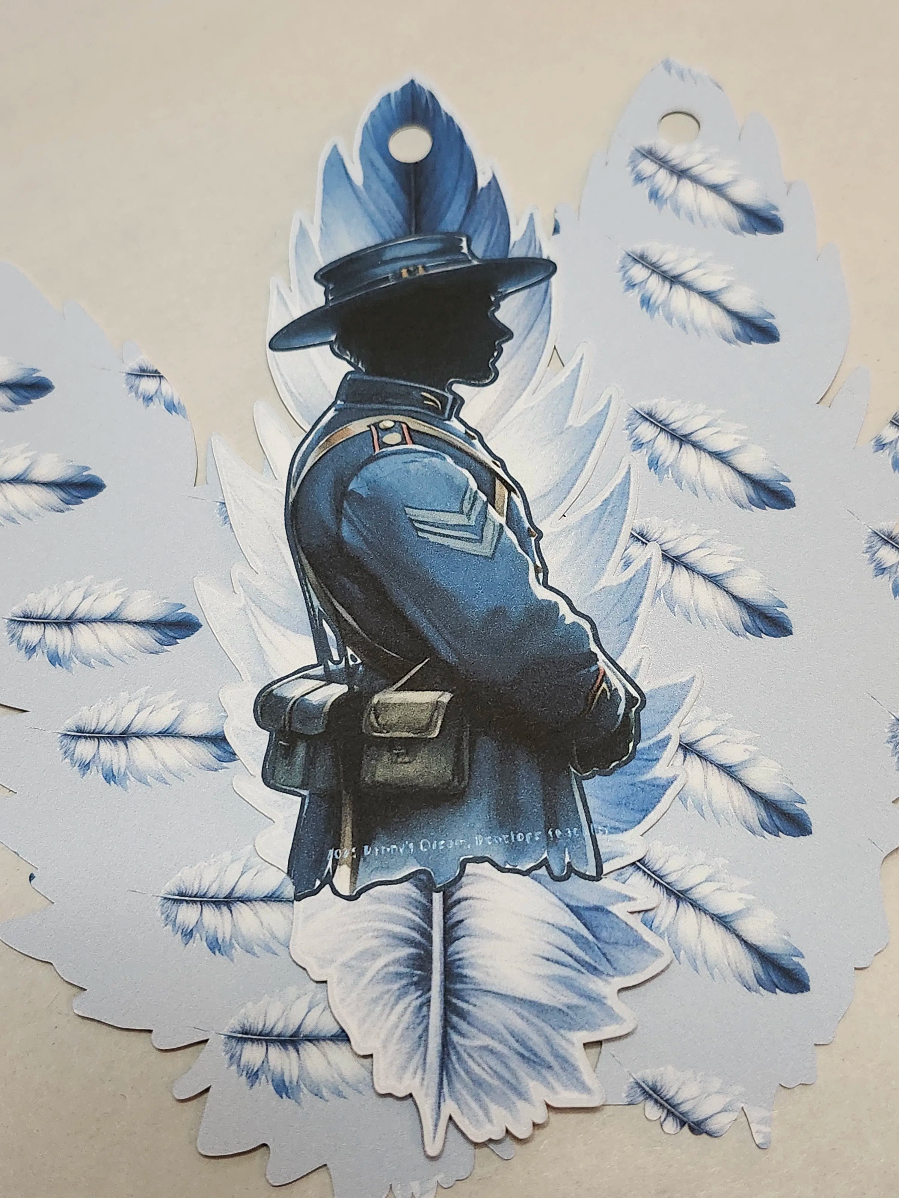 Silhouette of a person in uniform with decorative wings on a beige background