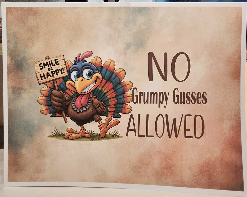A square printed sign or poster with a humorous Thanksgiving-themed illustration. It shows a cartoon turkey holding a sign that says 'SMILE OR HAPPY!' next to large brown text reading 'NO Grumpy Gueses ALLOWED' on a mottled beige and brown background.