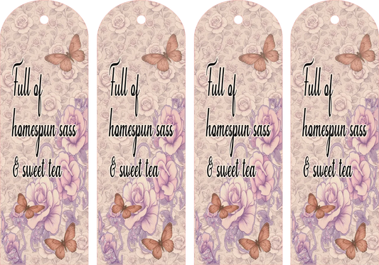 Four identical decorative bookmarks with butterfly designs and text on a floral patterned background.