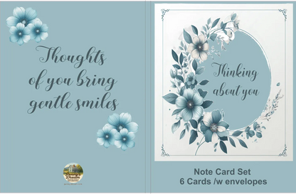 Note card set with floral design and text on a blue background