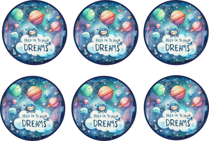 Six circular stickers with space-themed design and 'Hold on to your dreams' text.