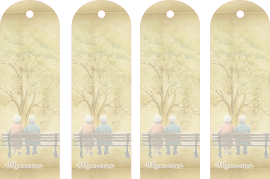 Four identical bookmarks with a design of two people sitting on a bench under a tree, labeled 'Memories'.