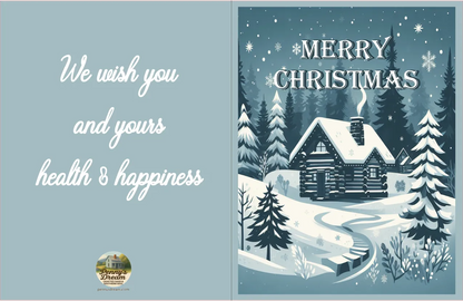 Christmas card with snowy cabin and trees, featuring a blue background and festive text.