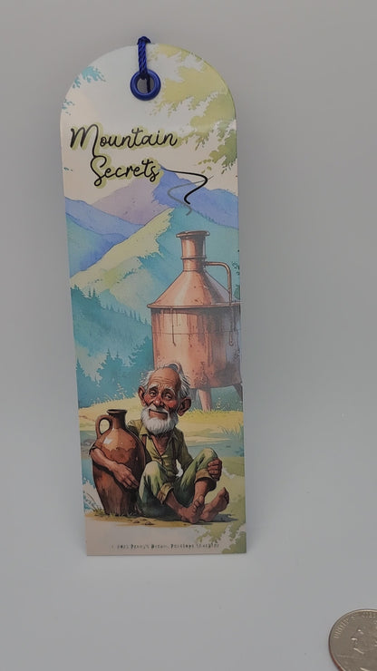 Mountain Secrets Bookmark – Moonshiner Design – 2x6 Laminated Cardstock with Dark Blue Tassel – Appalachian Collection – 2026 Edition